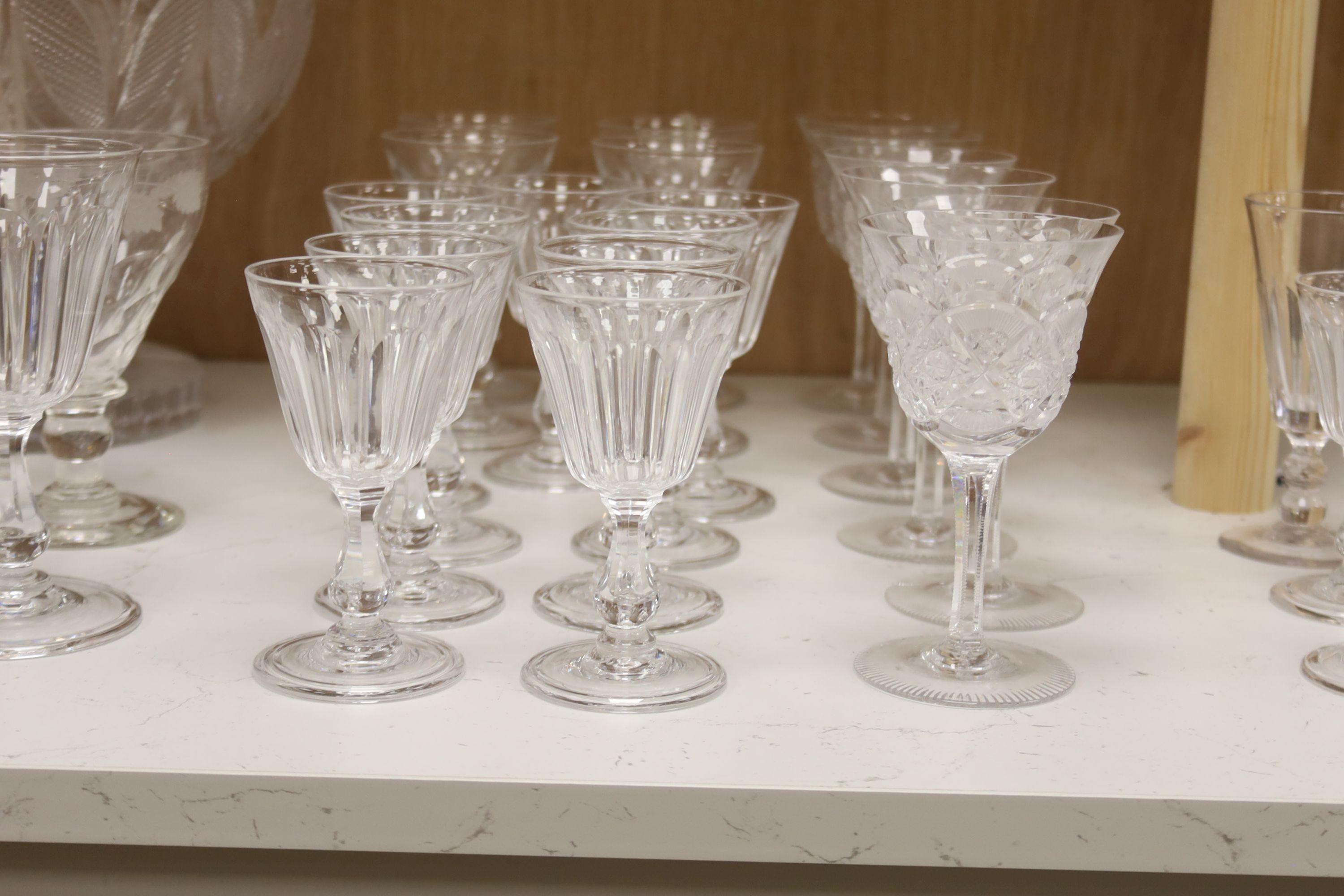 A cut glass punch bowl and a collection of table glassware, to include a late Victorian silver mounted decanter (lacking stopper)
